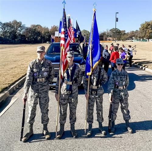 honor guard with flags standing before the parade lineup at Columbia Elementary